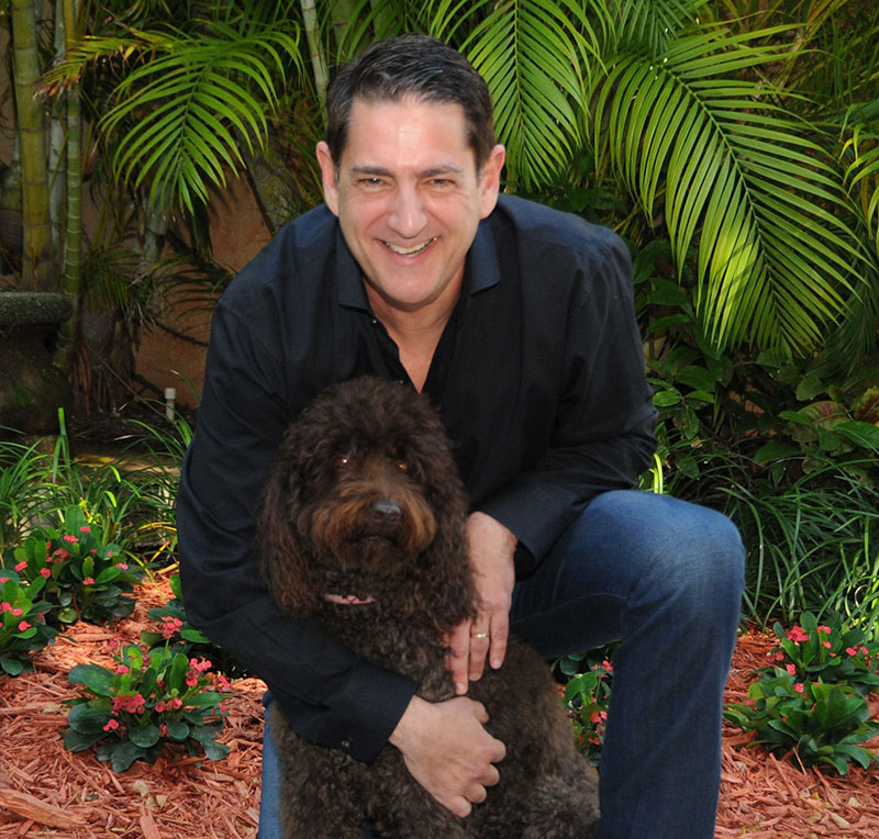 Professional photo of Jeff Karson with a dog