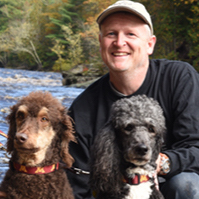 Dr. Bob Larocca with two poodles