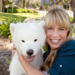 Dr Mary Gardner with a White Dog