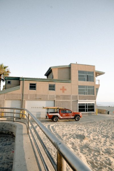 red-pickup-truck-parked-outside-lifeguard-station-2959588